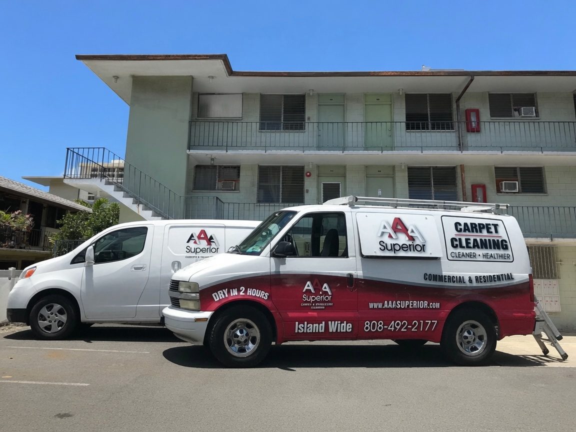 AAA Superior carpet cleaning vans on a job at an apartment building in Honolulu, Oahu